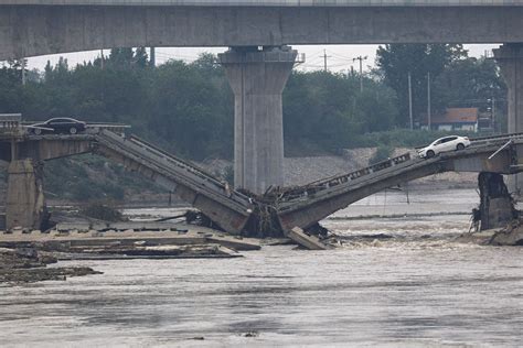Highway bridge in northern China collapses due to flash floods and casualties are unknown